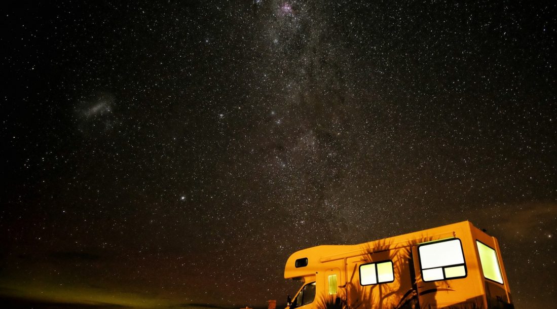 camper under stars